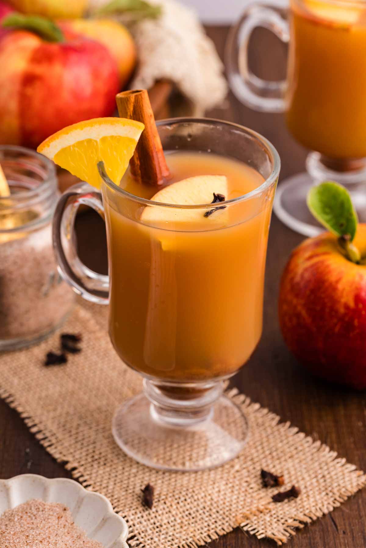 Enjoying a glass of hot apple cider.