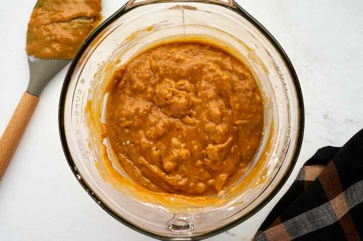 Mixing the batter for pumpkin bread.