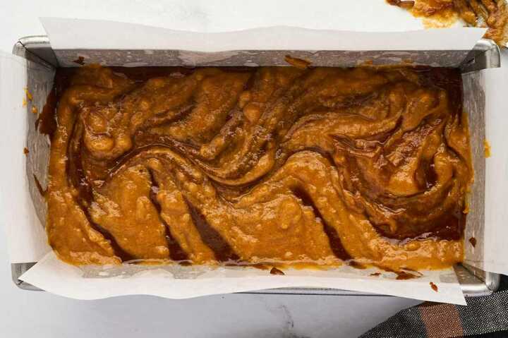 Swirling the batter.