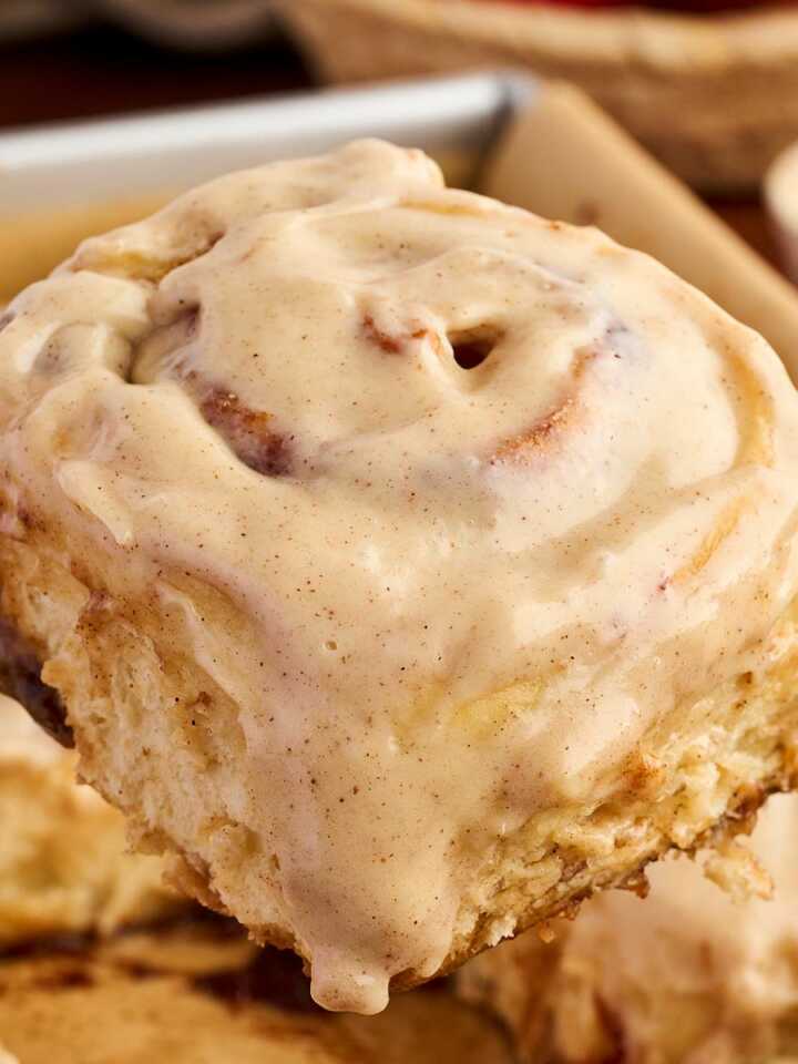 Serving a cinnamon roll with apple butter filling.