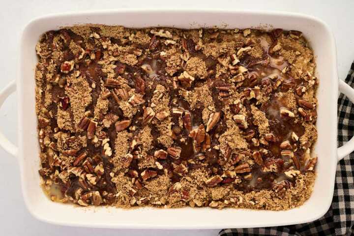 assembled cinnamon pecan coffee cake with butter drizzle before baking