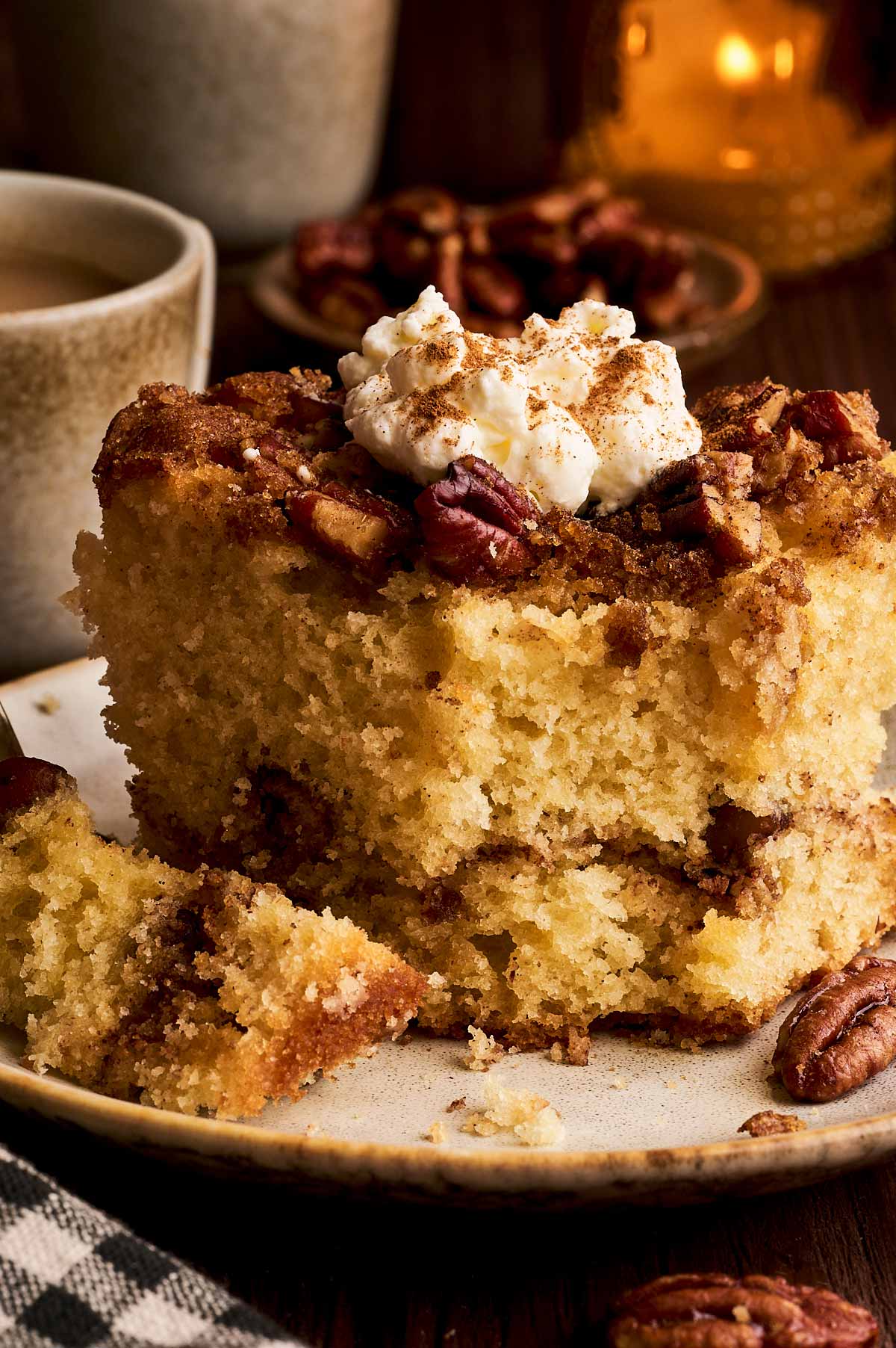 serving a slice of cinnamon pecan coffee cake