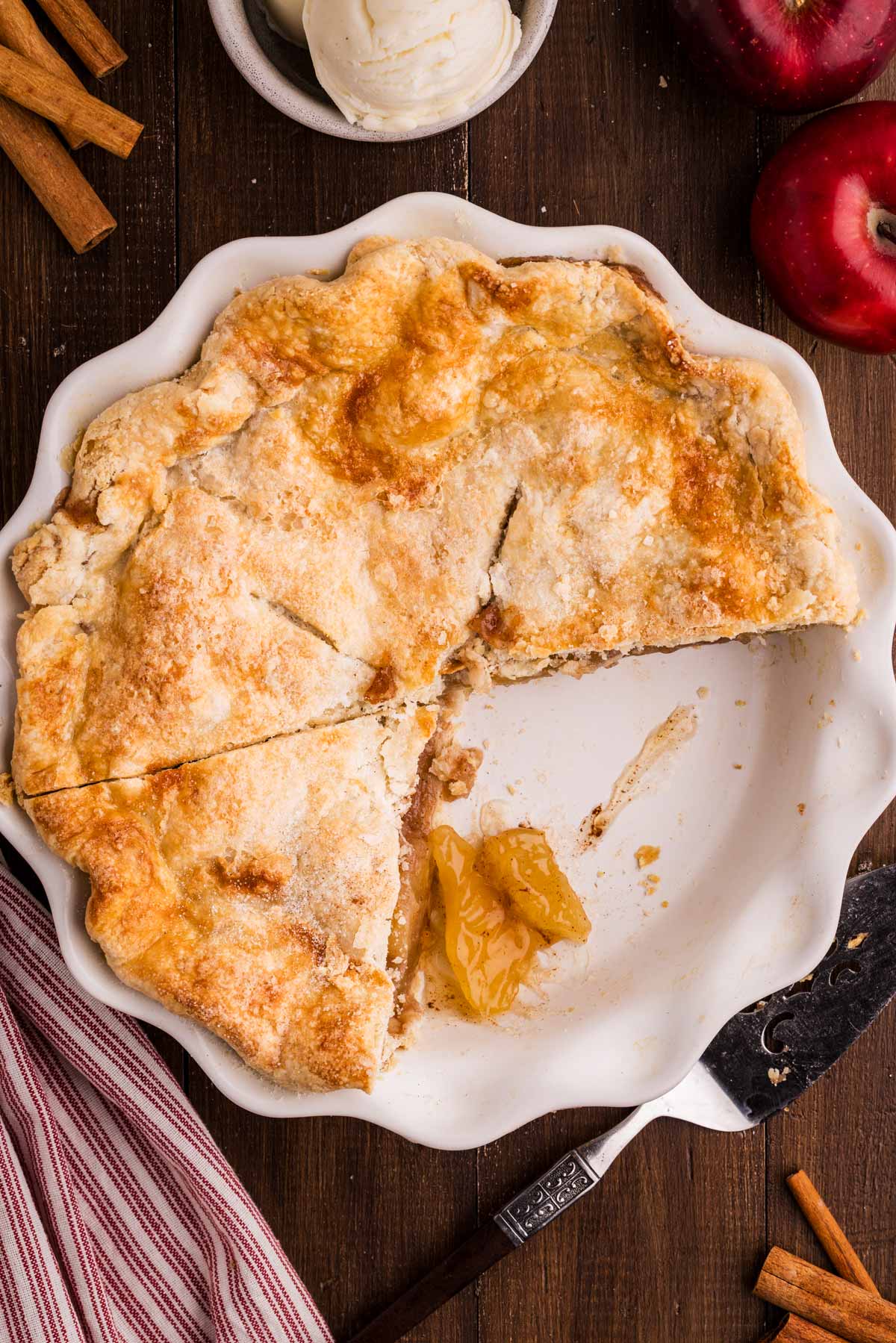 serving apple pie from a classic pie dish