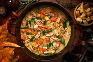 serving a pot of stew made with thanksgiving leftovers