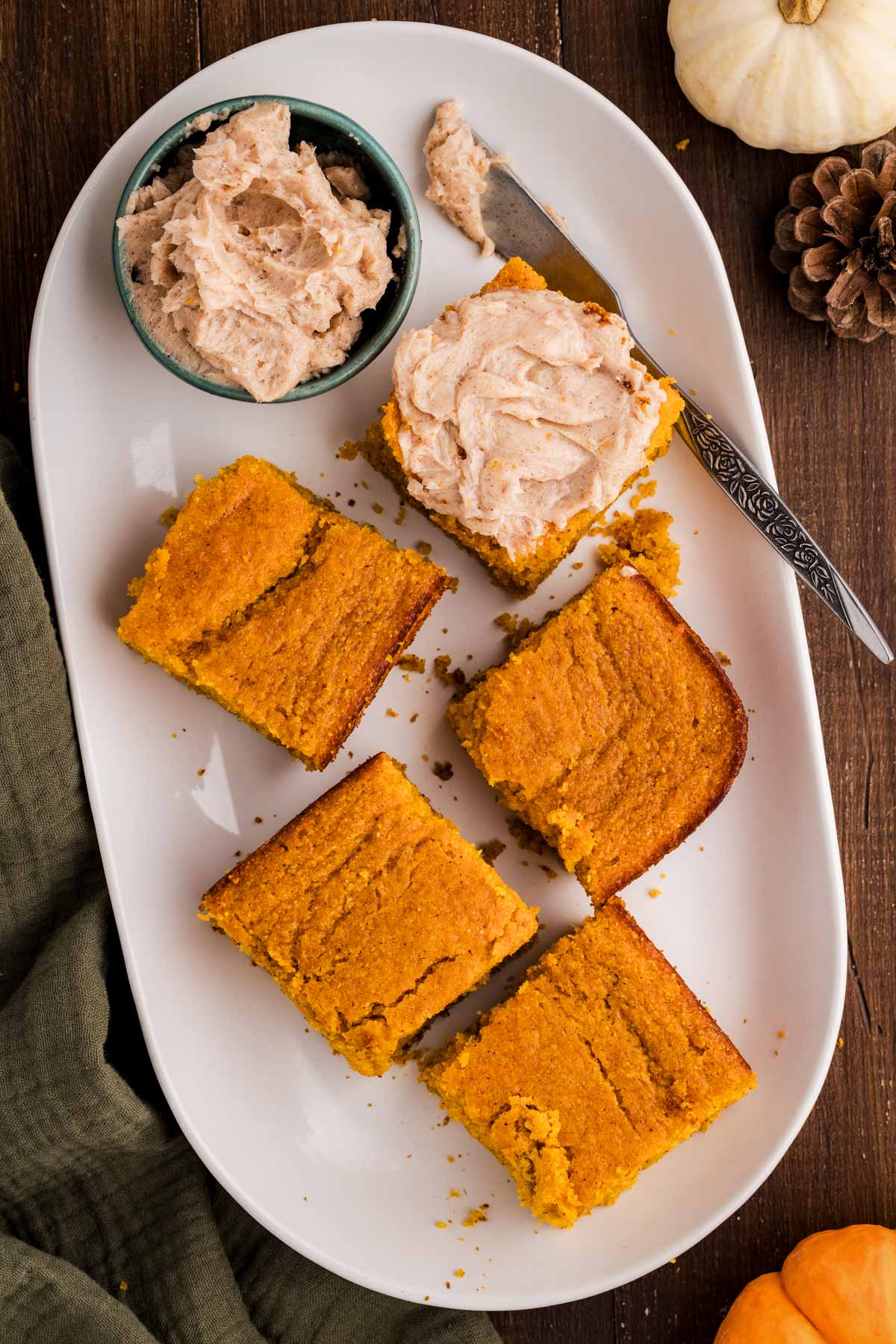serving up pumpkin cornbread on a platter with honey butter