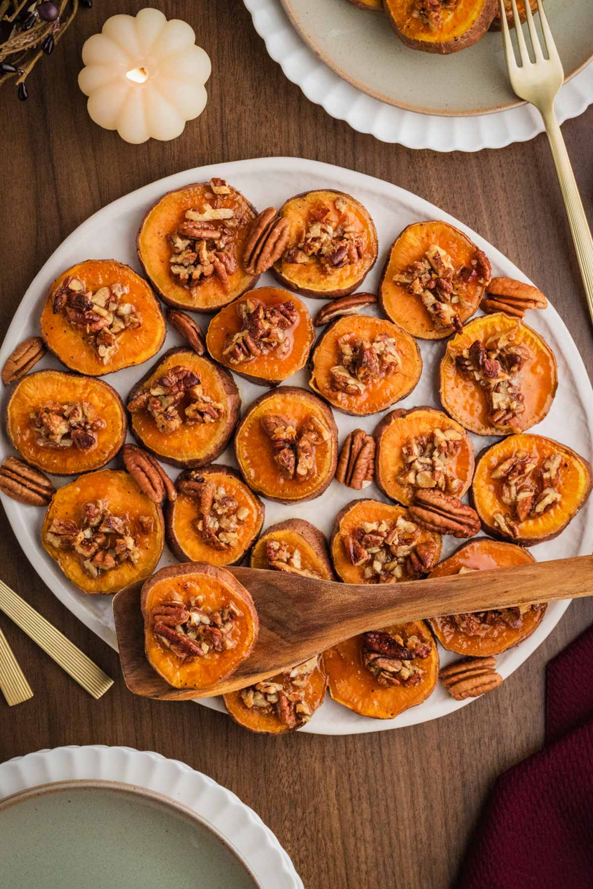 a plate of maple pecan roasted sweet potato slices
