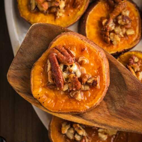 serving a maple pecan roasted sweet potato slice