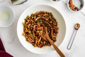 maple pecan topping being stirred in a bowl