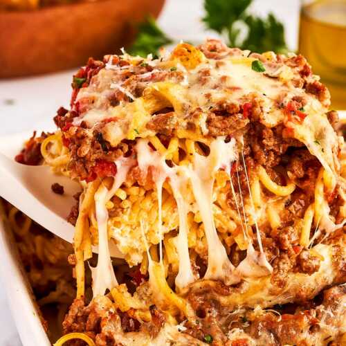 serving spaghetti casserole from the dish