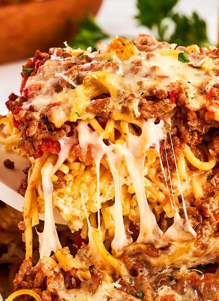 serving spaghetti casserole from the dish