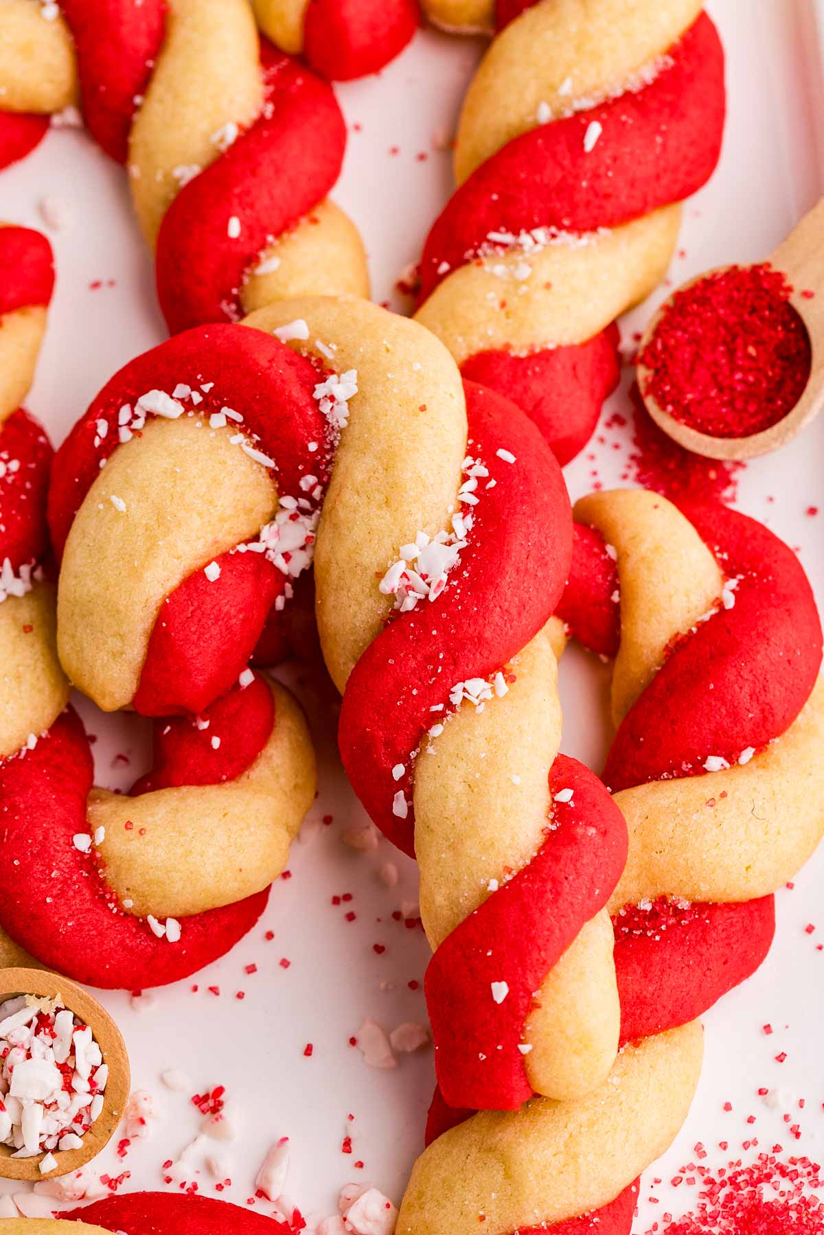 piling up candy cane cookies on a plate