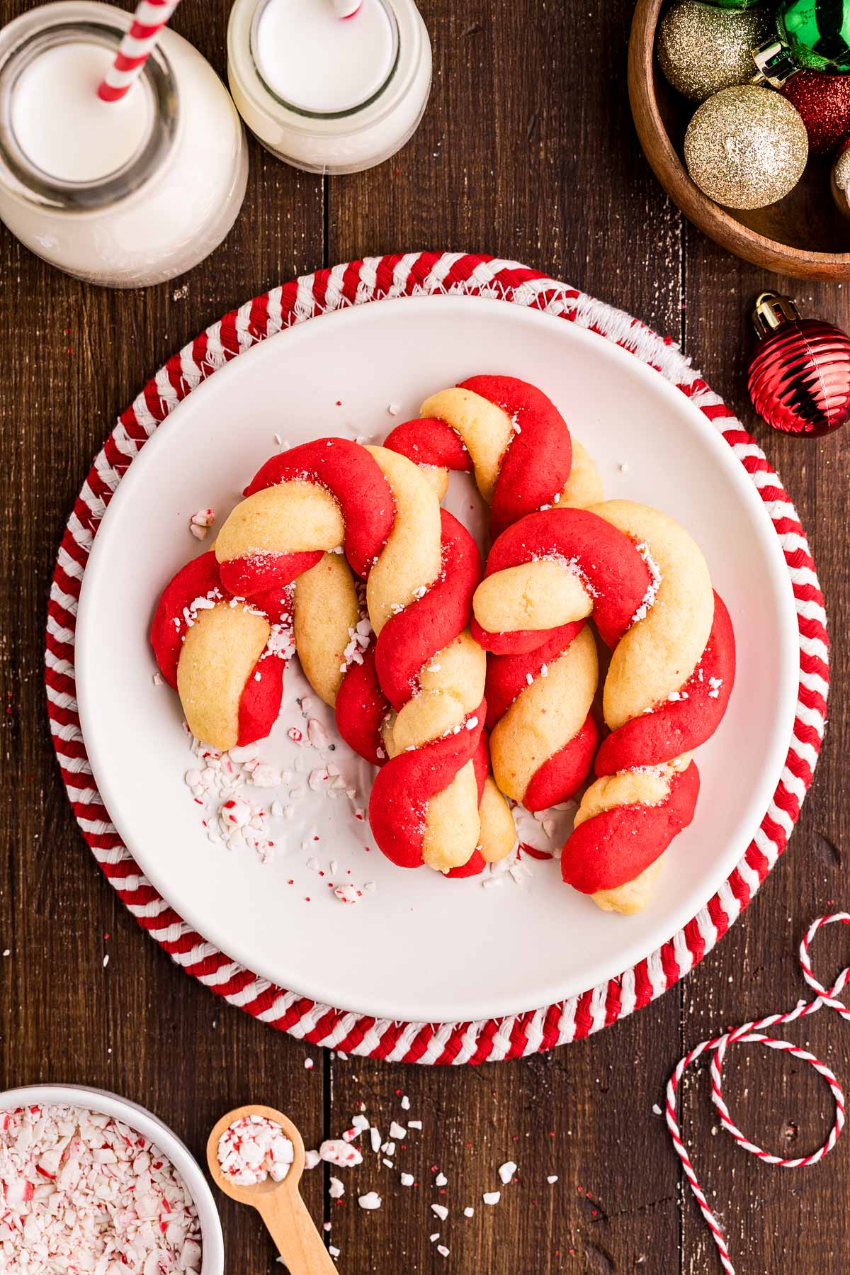 serving a plate of candy cane cookies with milk
