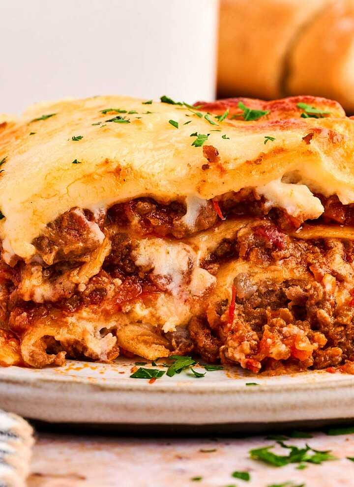 layers of cheesy lasagna on a plate