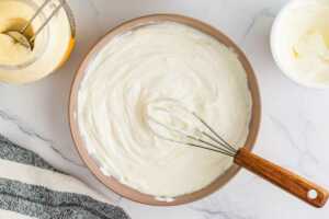 Whisking the base for dill dip.
