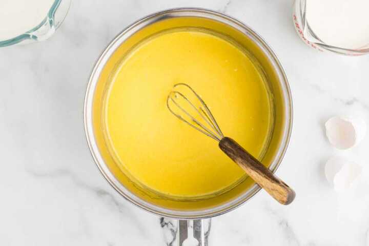 whisking egg yolks with sugar for eggnog
