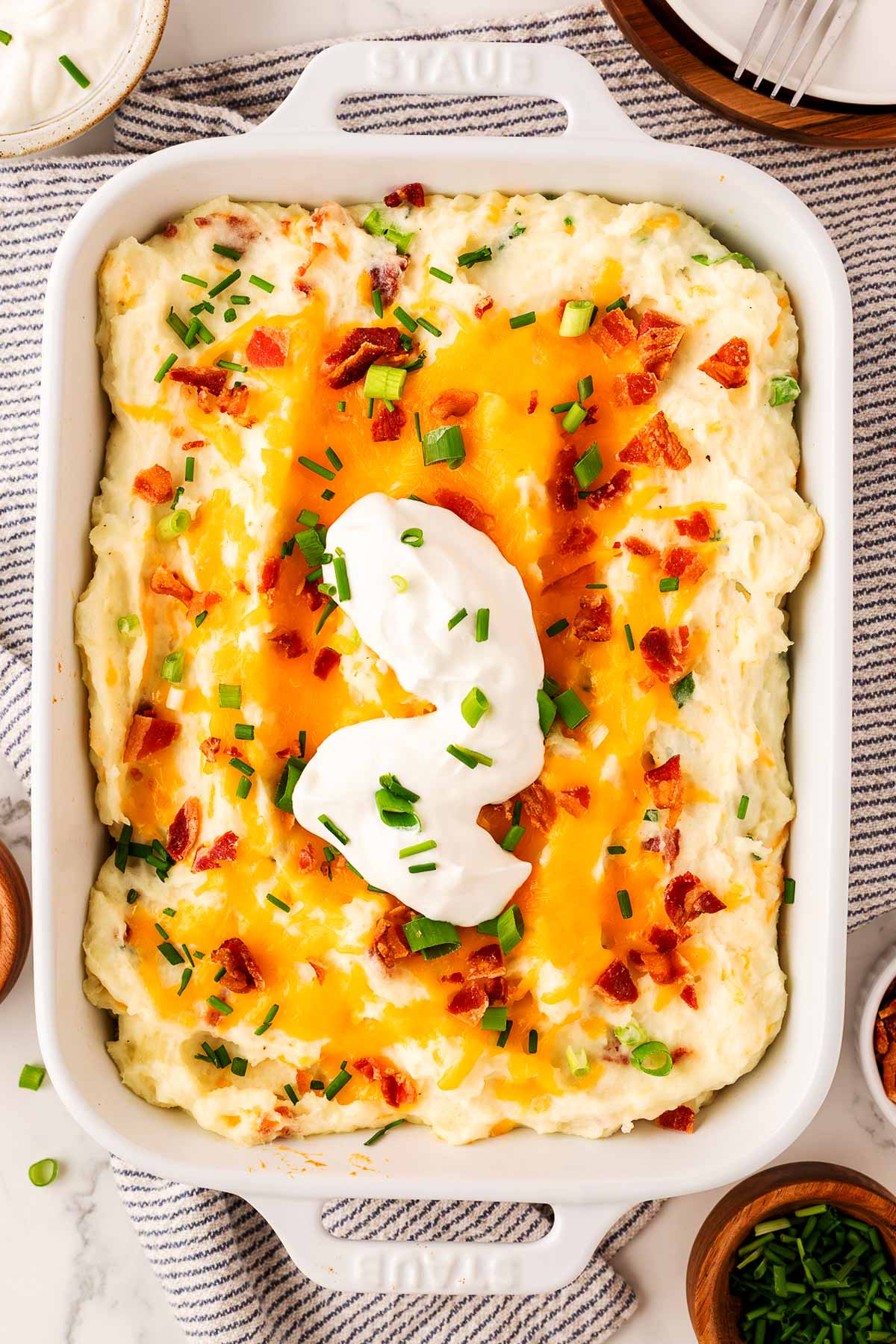 serving mashed potato casserole with sour cream