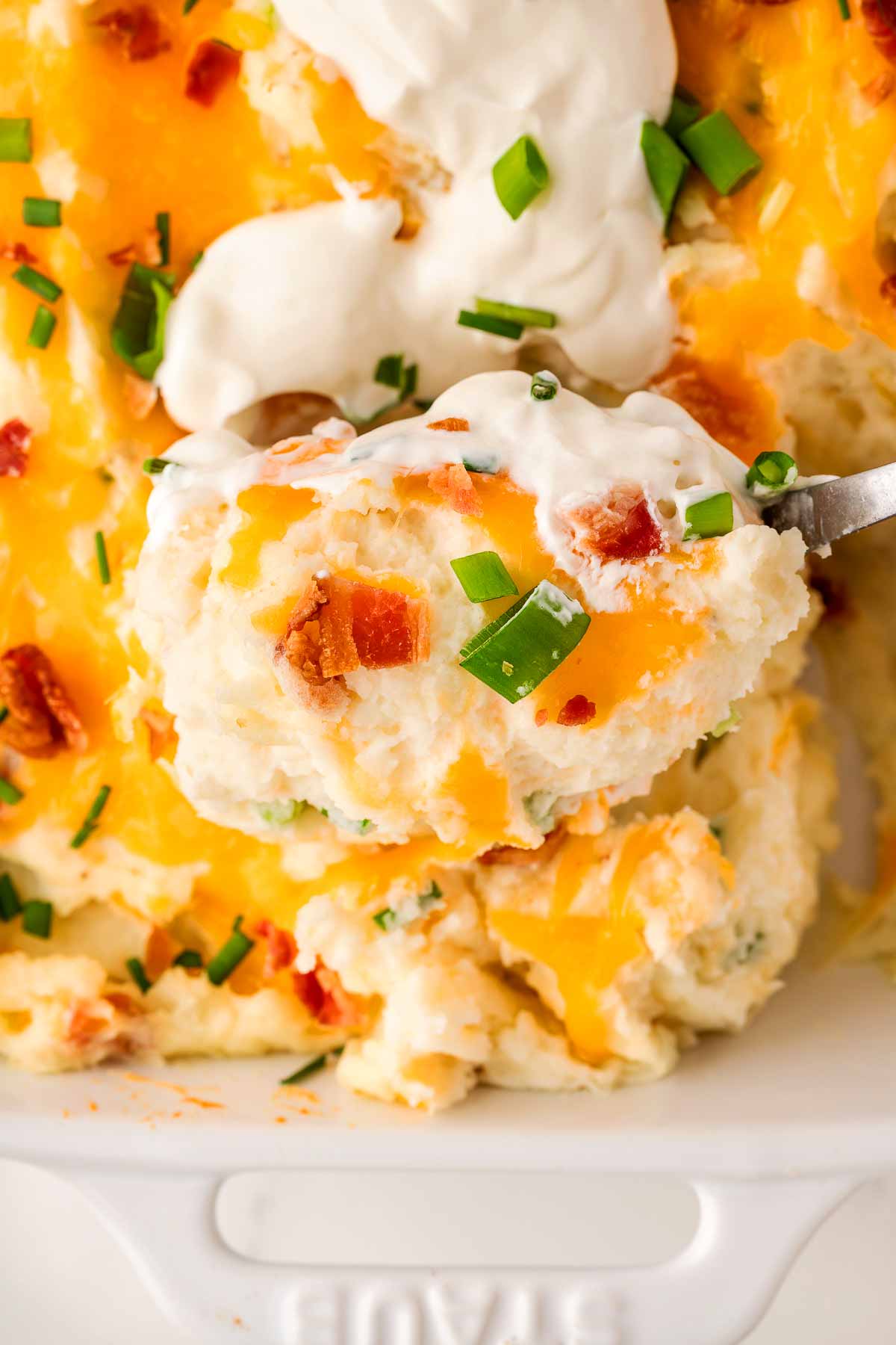 scooping up mashed potato casserole