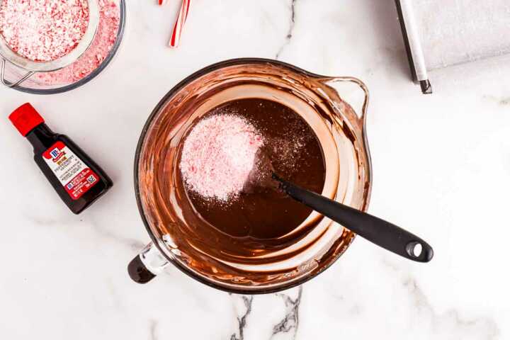 melting dark chocolate with candy cane dust