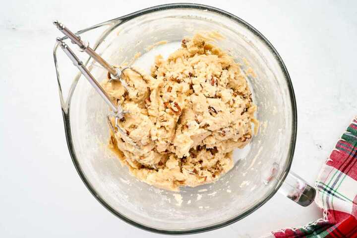 Finishing cookie dough for Snowball Cookies.