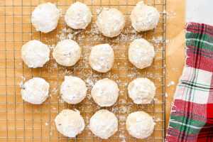 Cooling Snowball Cookies on a wire rack.