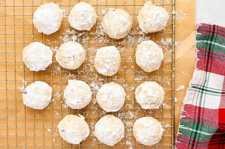 Cooling Snowball Cookies on a wire rack.