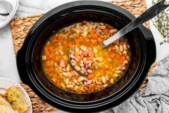 serving ham and bean soup from the slow cooker