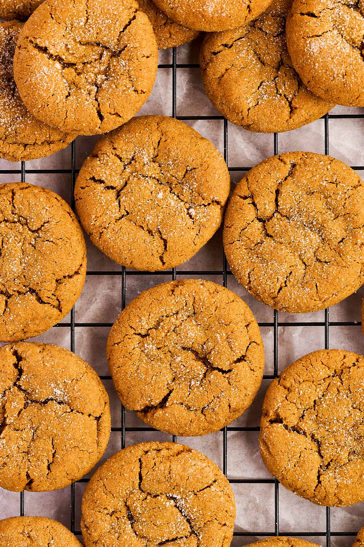 cooling ginger molasses cookies on a wire rack