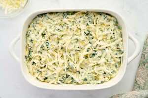 spinach artichoke dip ready for baking