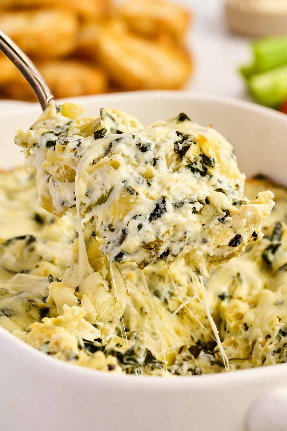 Scooping up spinach artichoke dip.
