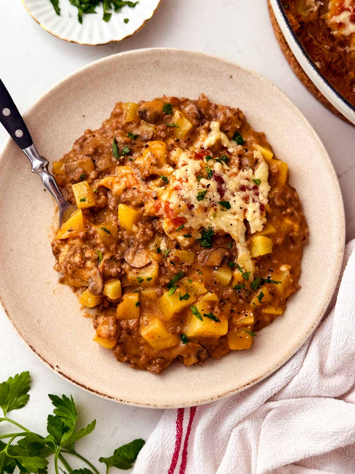 a plate of ground beef and potato casserole