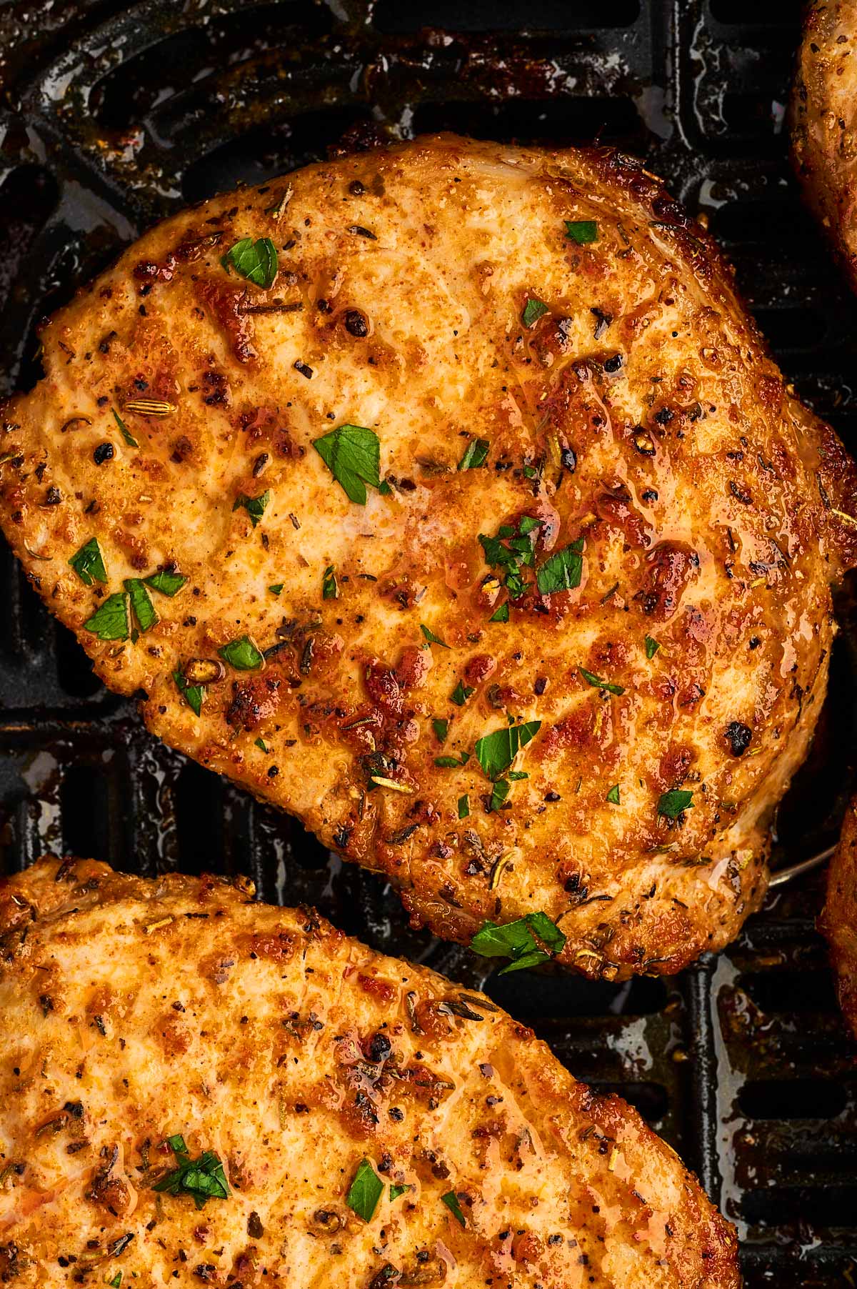 Close up photo of juicy air fried pork chops.