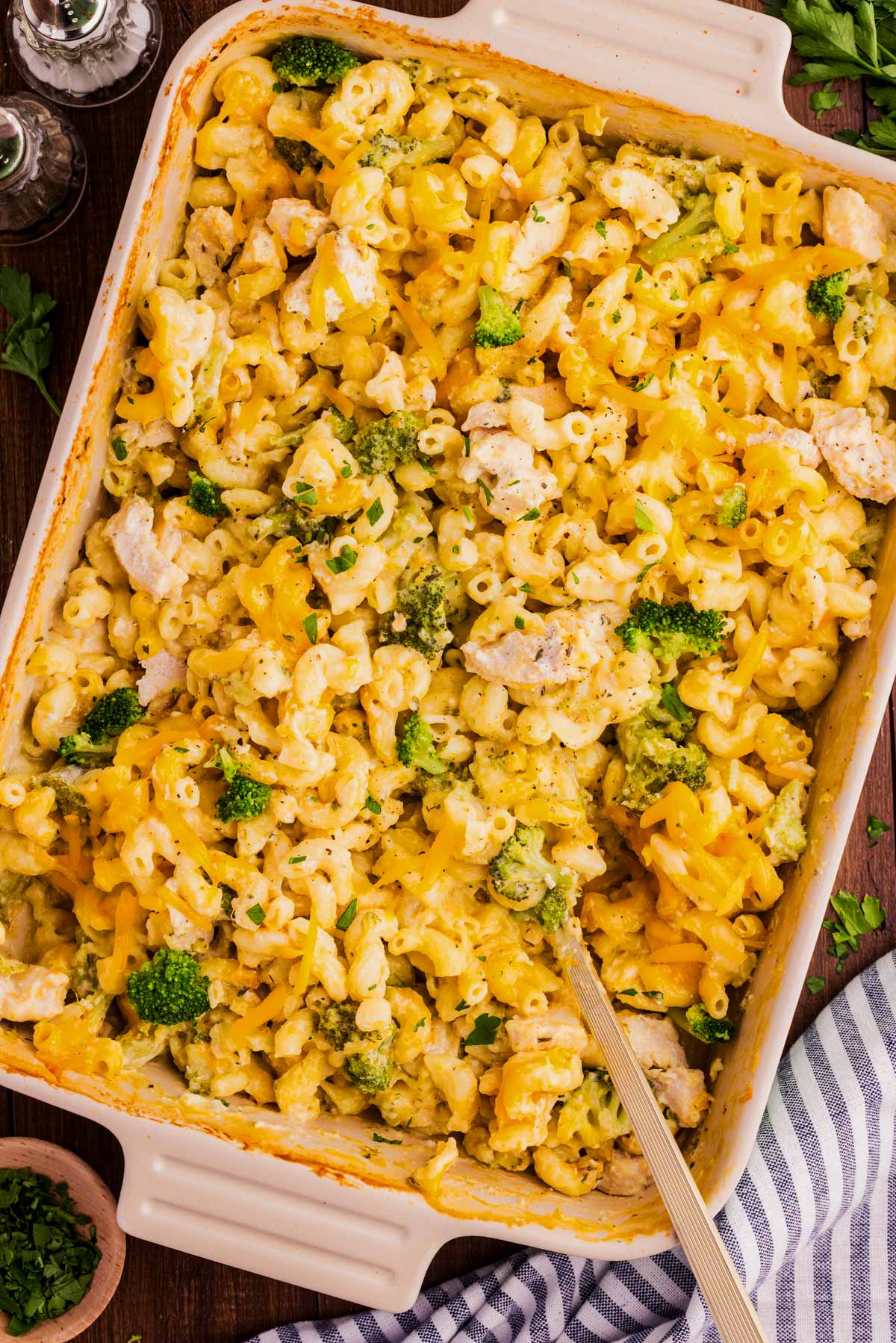 Serving chicken broccoli pasta casserole from the dish.