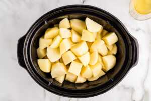 Starting mashed potatoes in the slow cooker.