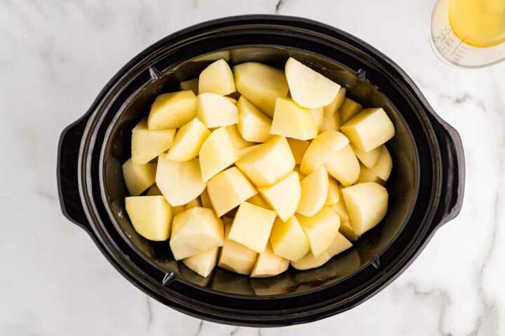 Starting mashed potatoes in the slow cooker.