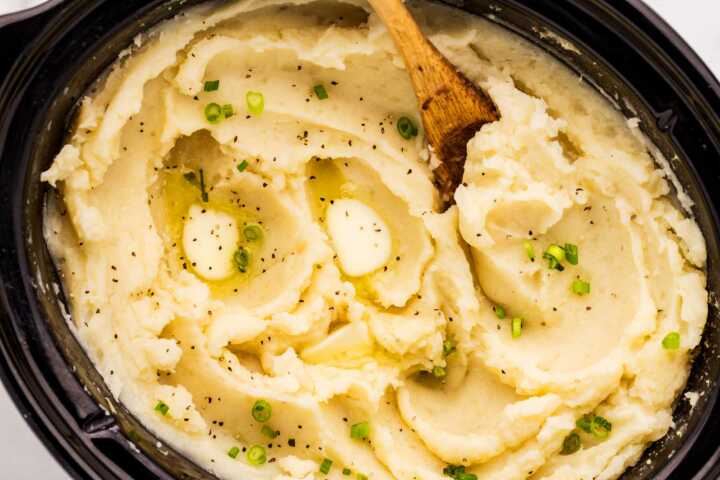 Serving slow cooker mashed potatoes from the crock.