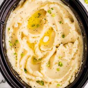 Serving mashed potatoes from a slow cooker.
