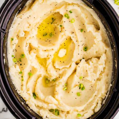 Serving mashed potatoes from a slow cooker.
