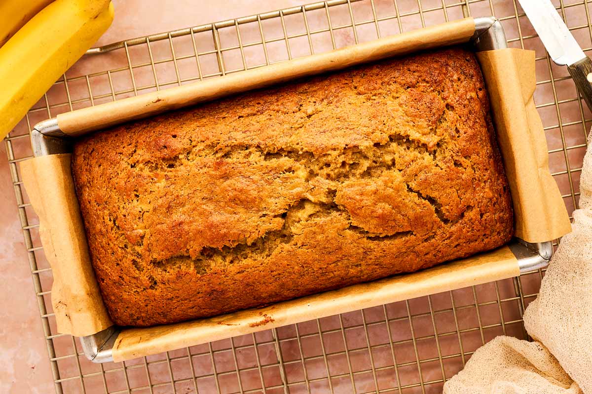 Banana bread cooling on a cooling rack.