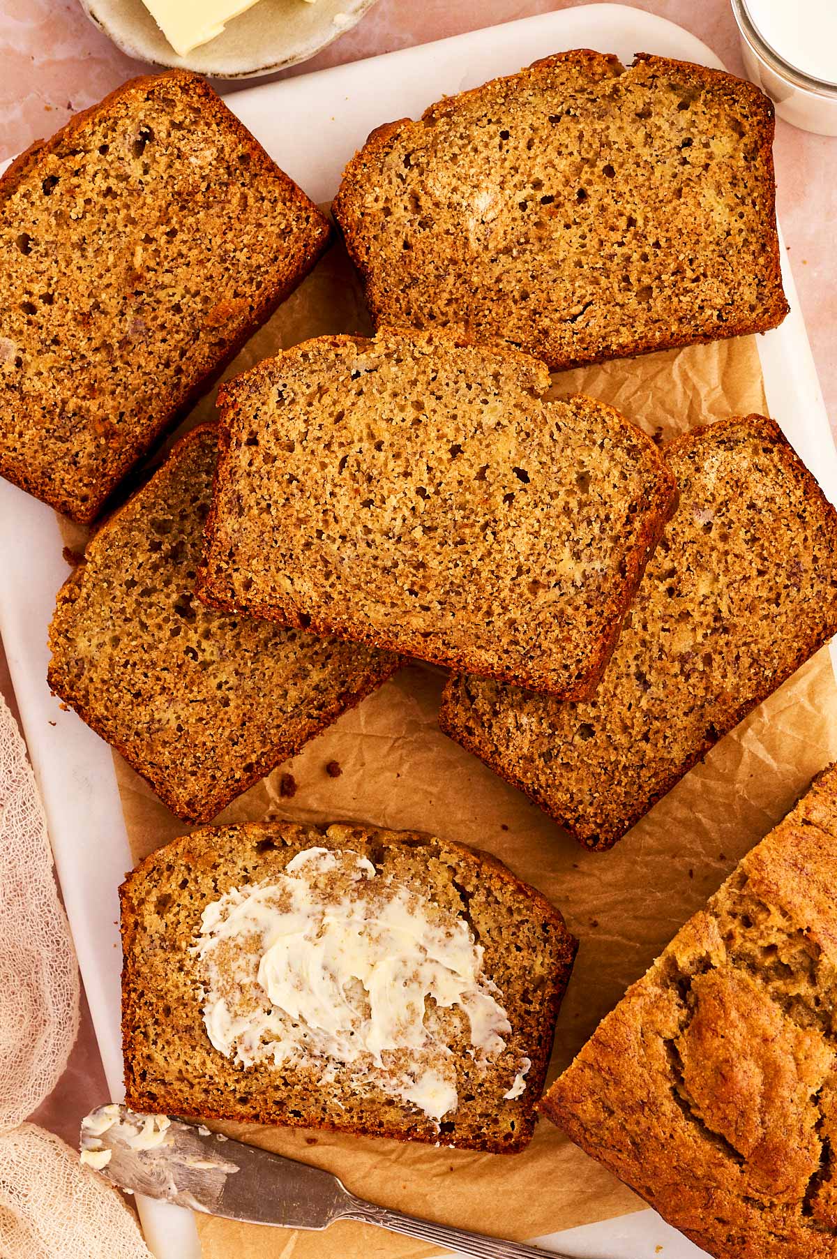 slices of healthy banana bread, one buttered
