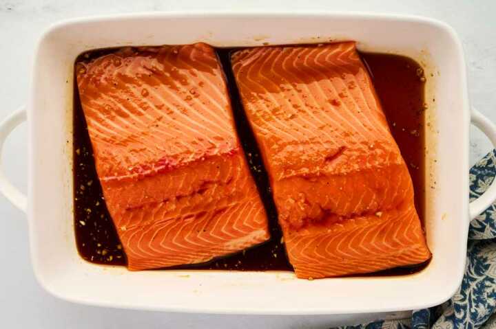 Marinating salmon in honey glaze.