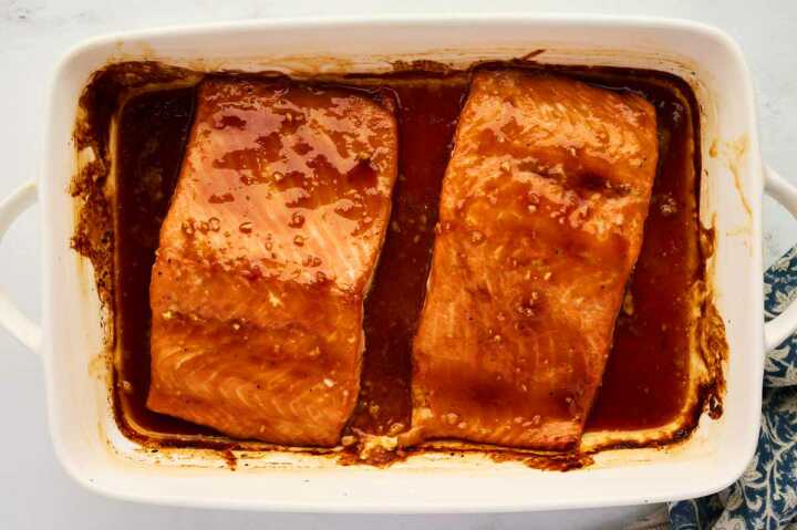 Serving honey glazed salmon in a casserole dish.
