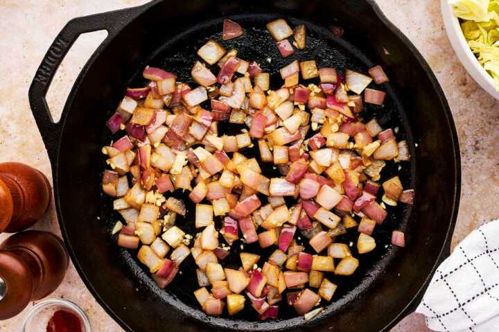 Sautéed red onion in cast iron skillet.