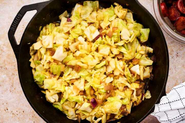 Sautéed cabbage in cast iron skillet.