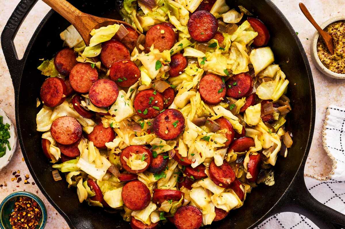 Finishing cabbage and sausage in the skillet.