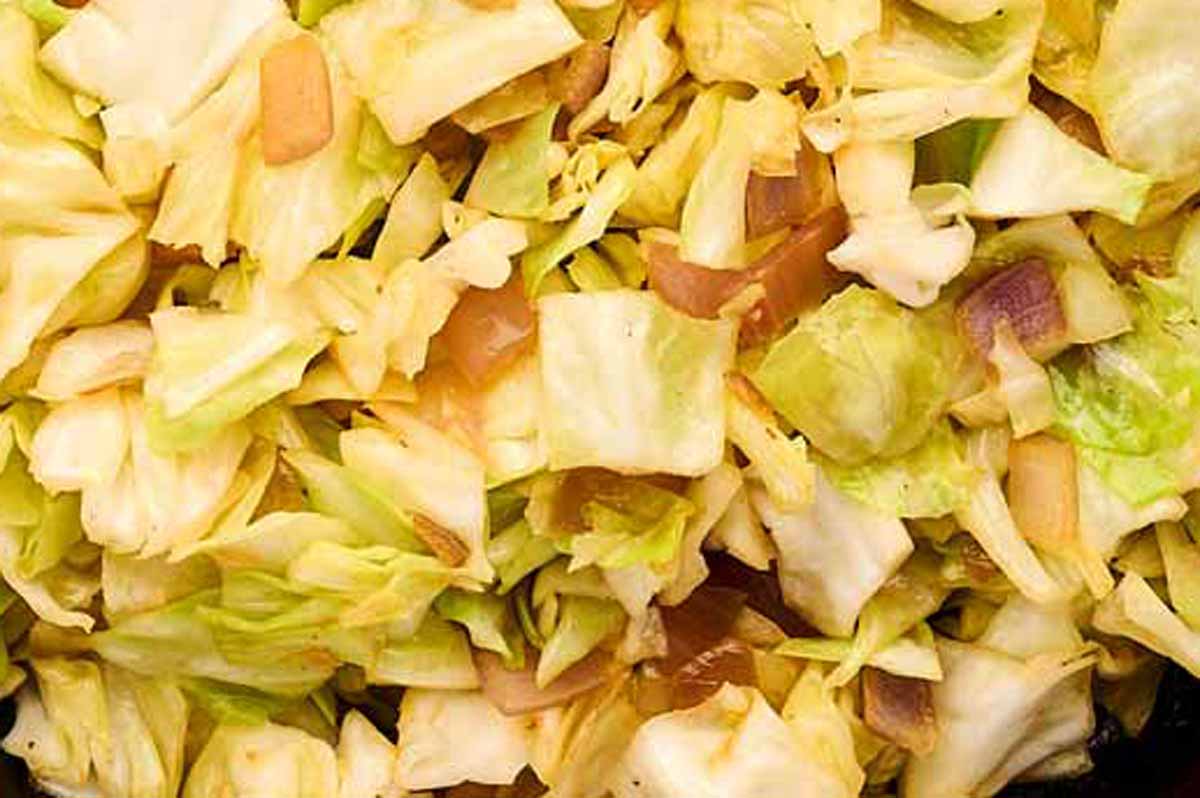 Diced cabbage in a skillet.