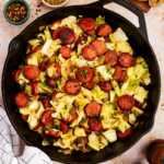 Serving kielbasa and sausage from a cast iron skillet.