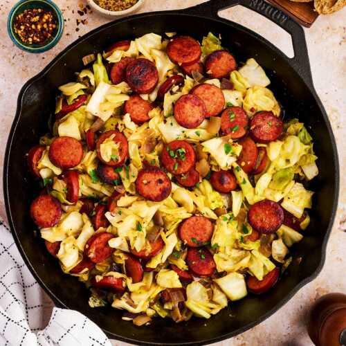 Serving kielbasa and sausage from a cast iron skillet.