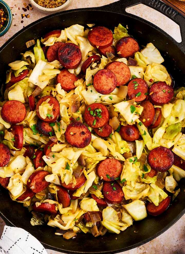 Serving kielbasa and sausage from a cast iron skillet.
