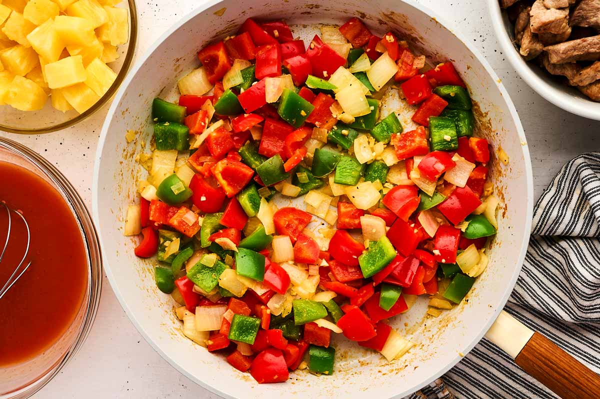 Sautéed vegetables in skillet.