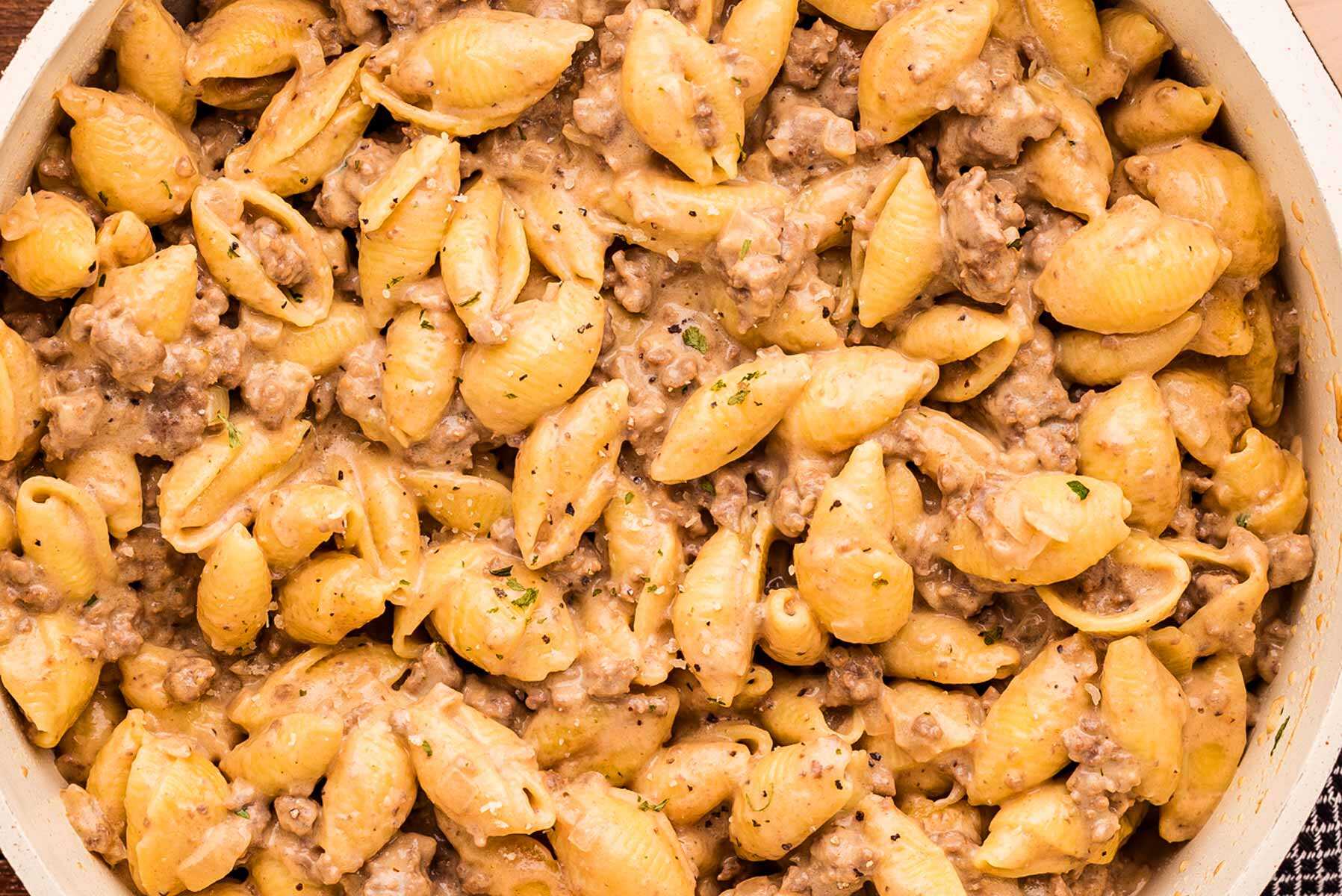 Ground beef and pasta in a pot.